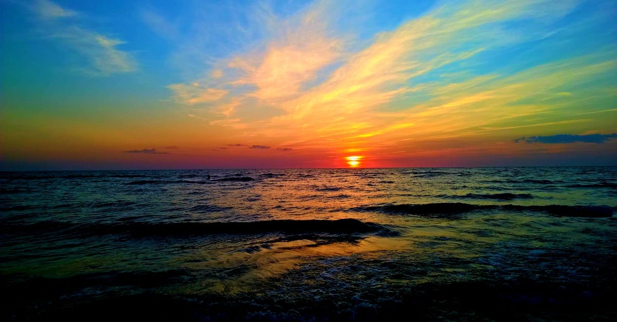 Body of Water Under Blue and Whit Sky · Free Stock Photo