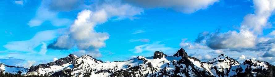 White and Black Snowy Mountain Under Blue Cloudy Sky
