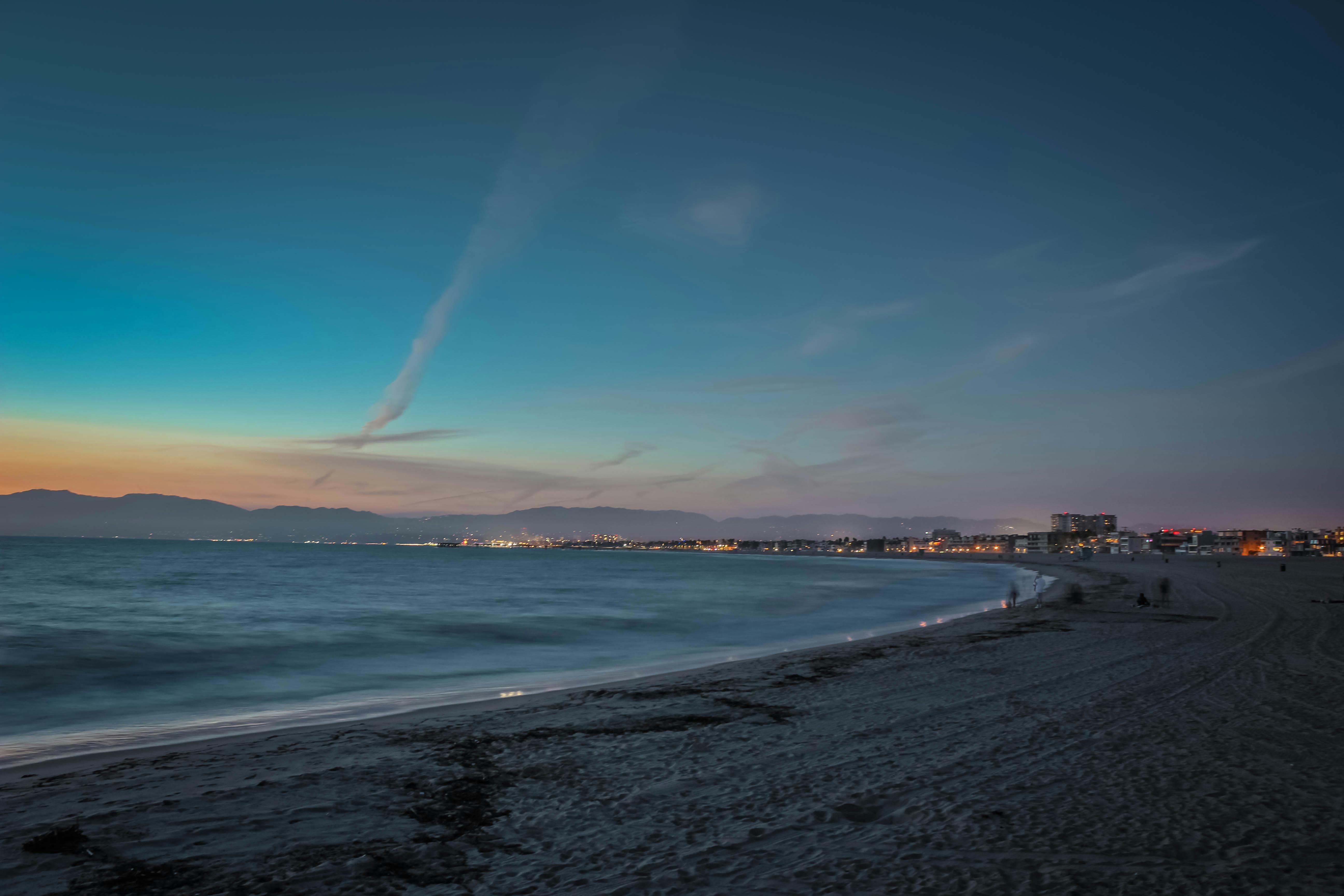 People On Beachs Seashore During Sunset · Free Stock Photo