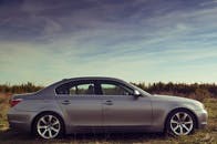 Silver Sedan On Gray Road · Free Stock Photo