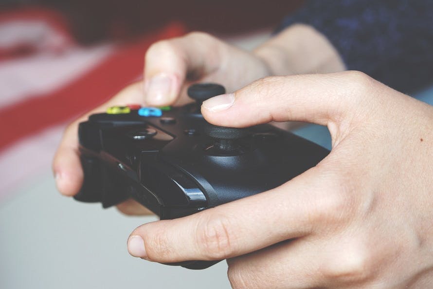 Man Holding Xbox One Controller. (Image provided by Pexels)