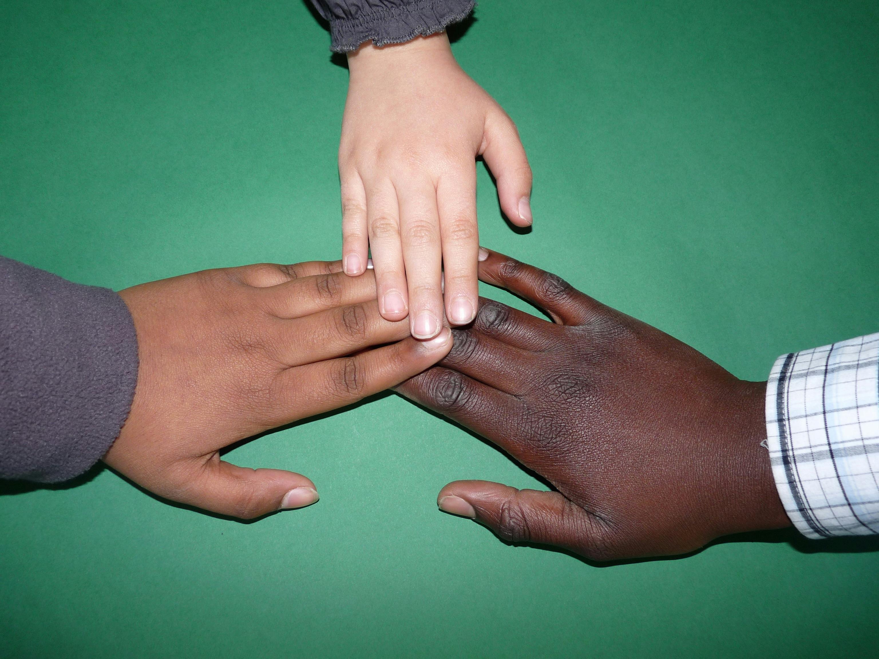 2 Person and 1 Child Connected Hands · Free Stock Photo