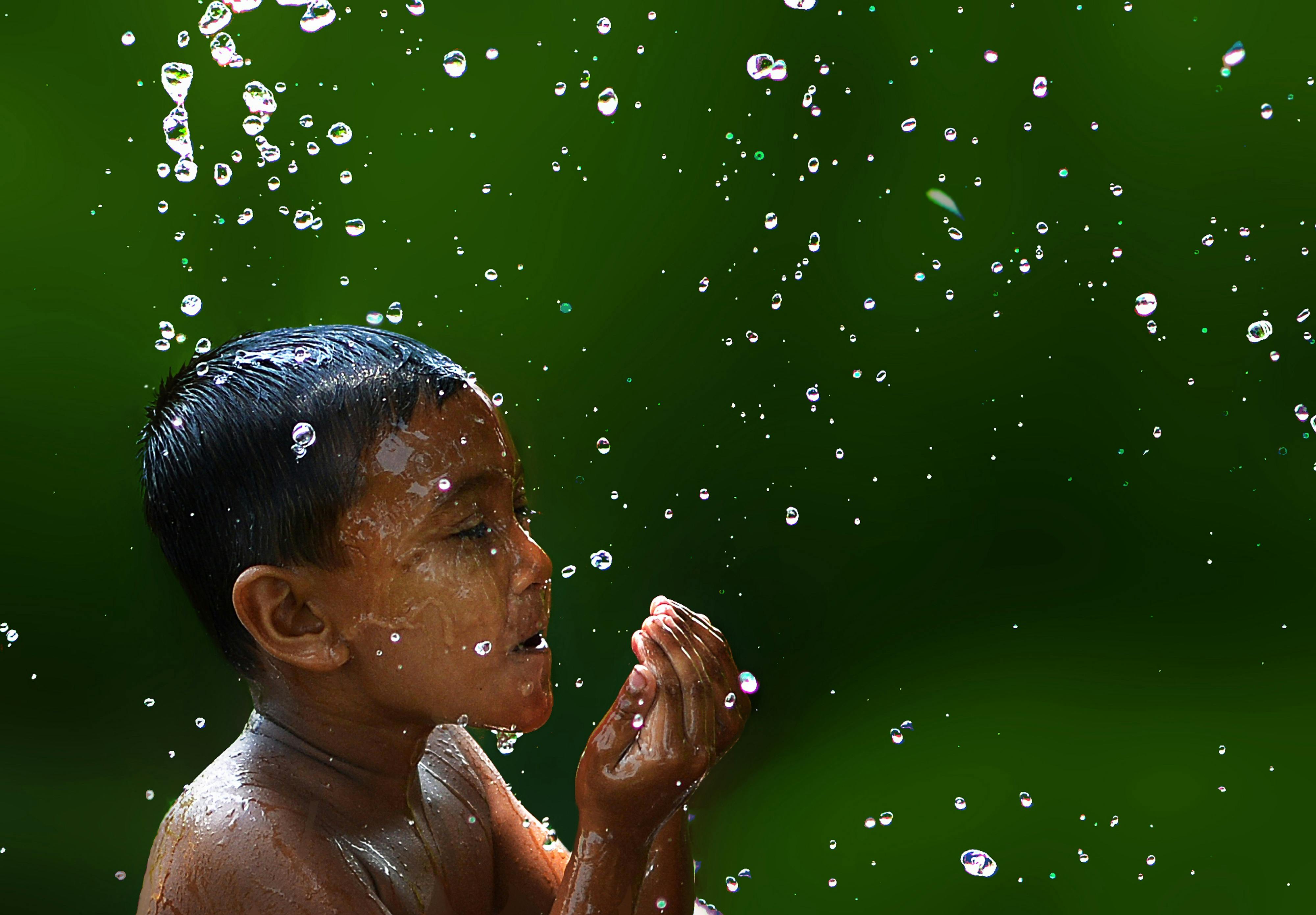 Wet Boy With Water  Droplets in Slow  Motion  Photography  