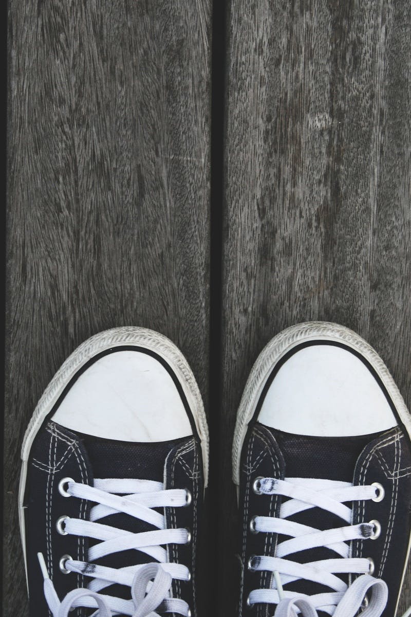 Black and White Sneakers on Grey Wooden Wood · Free Stock Photo