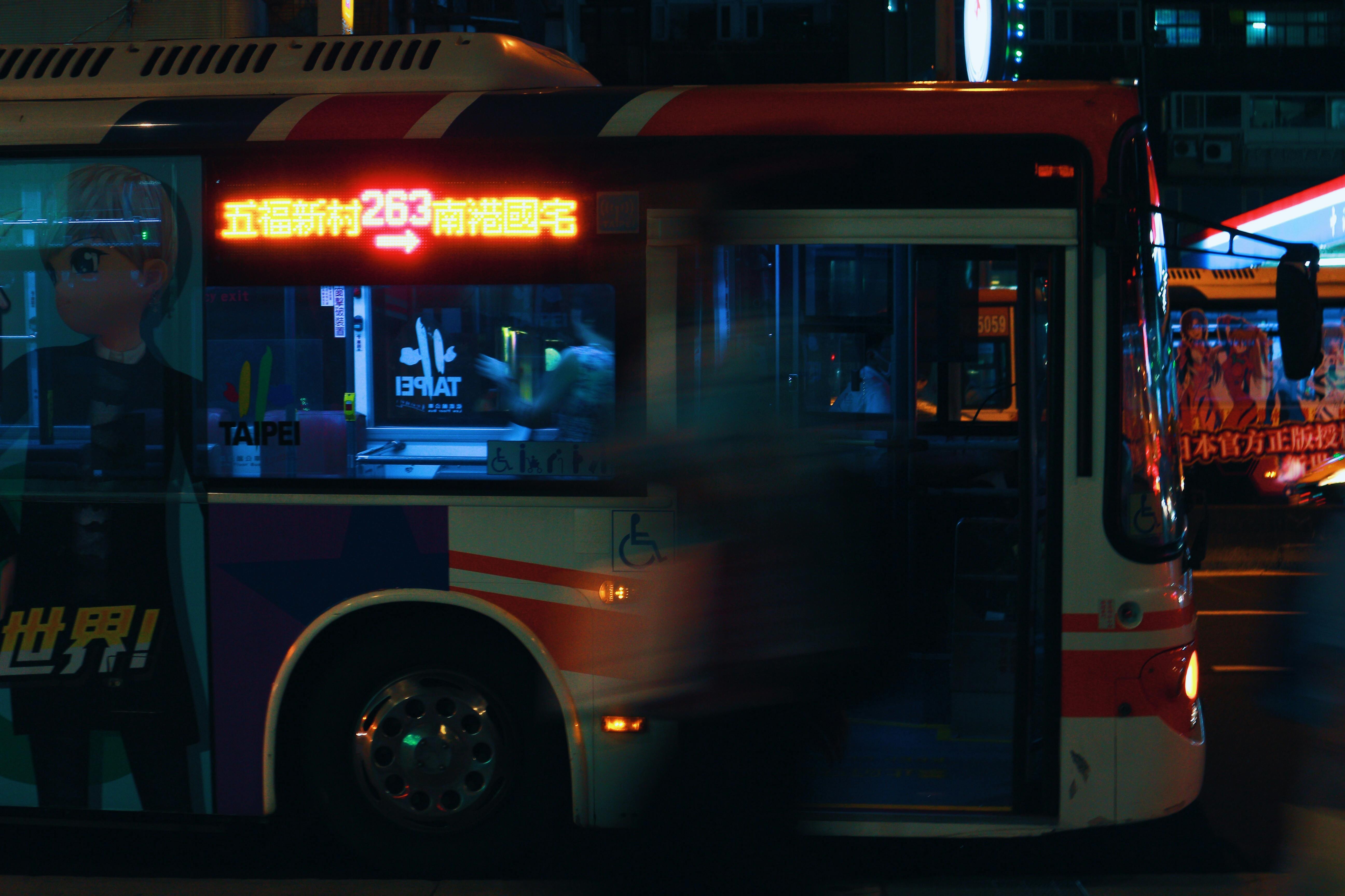 Silver City Bus on a City Street at Night · Free Stock Photo