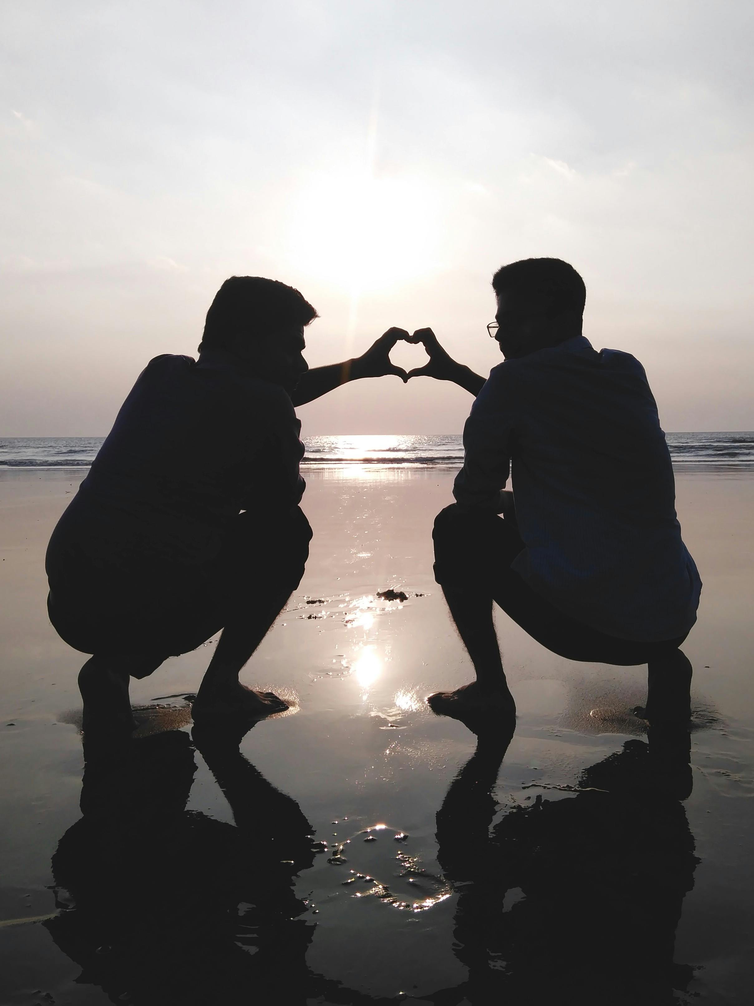 Silhouette Of 2 Man Making Heart Sign