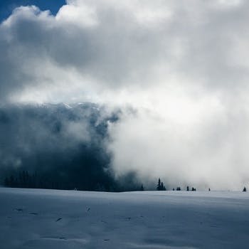 Blue and White Clouds and White Snow