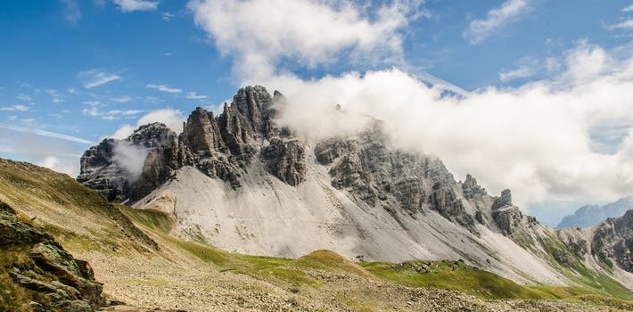 White Black Mountain Reaching Clouds