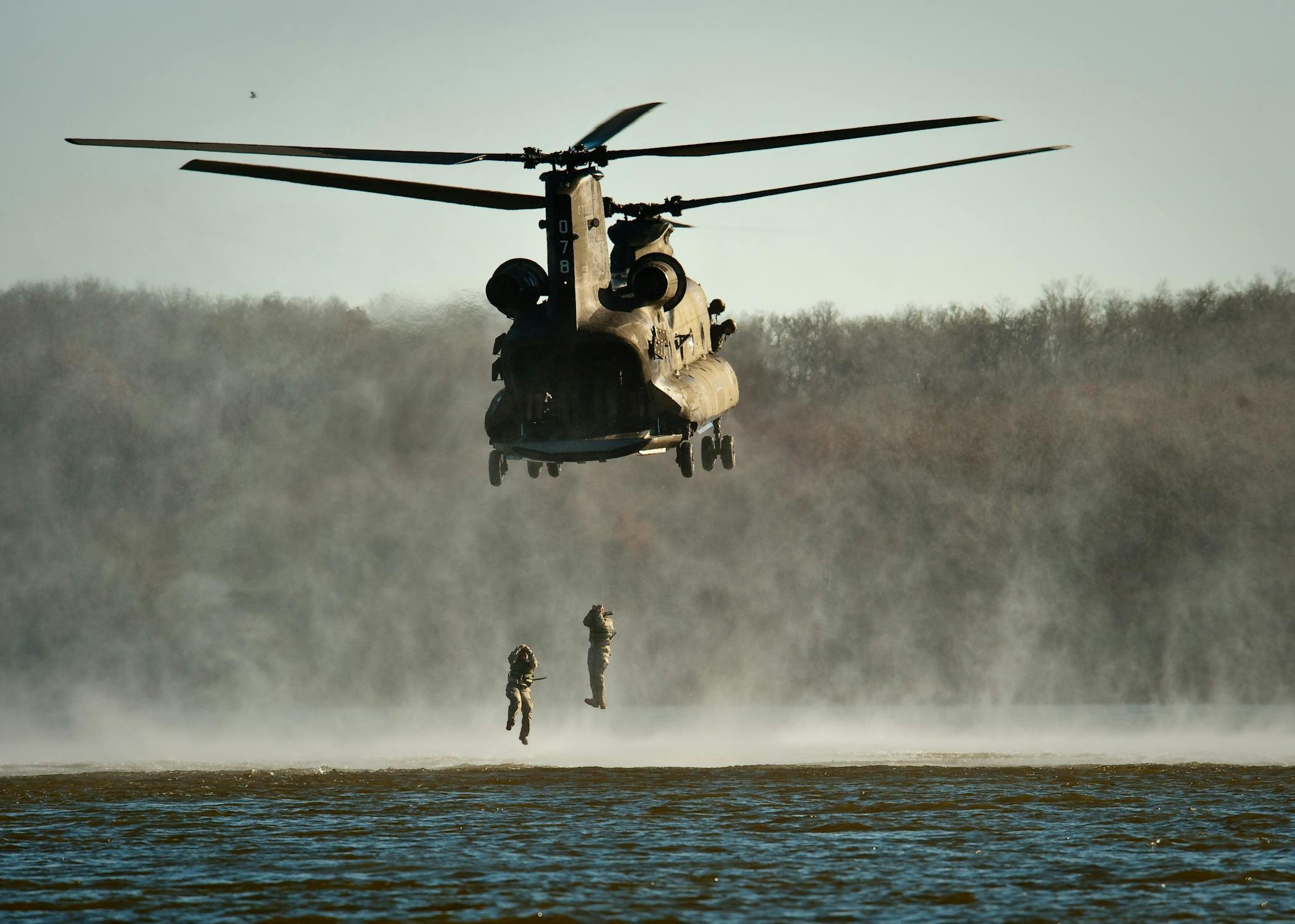 Gray Helicopter Above Body Of Water · Free Stock Photo