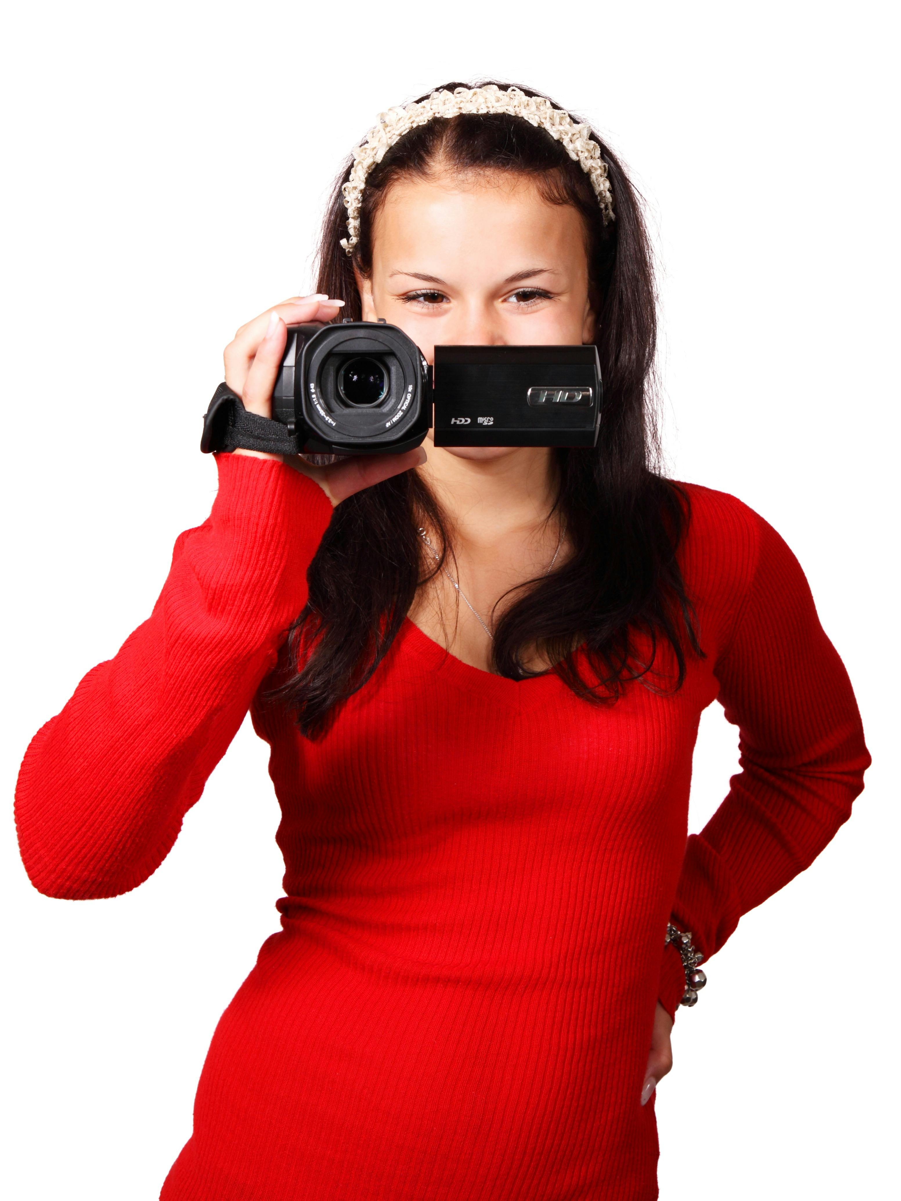  Woman  Holding a Black Video Camera   Free Stock Photo