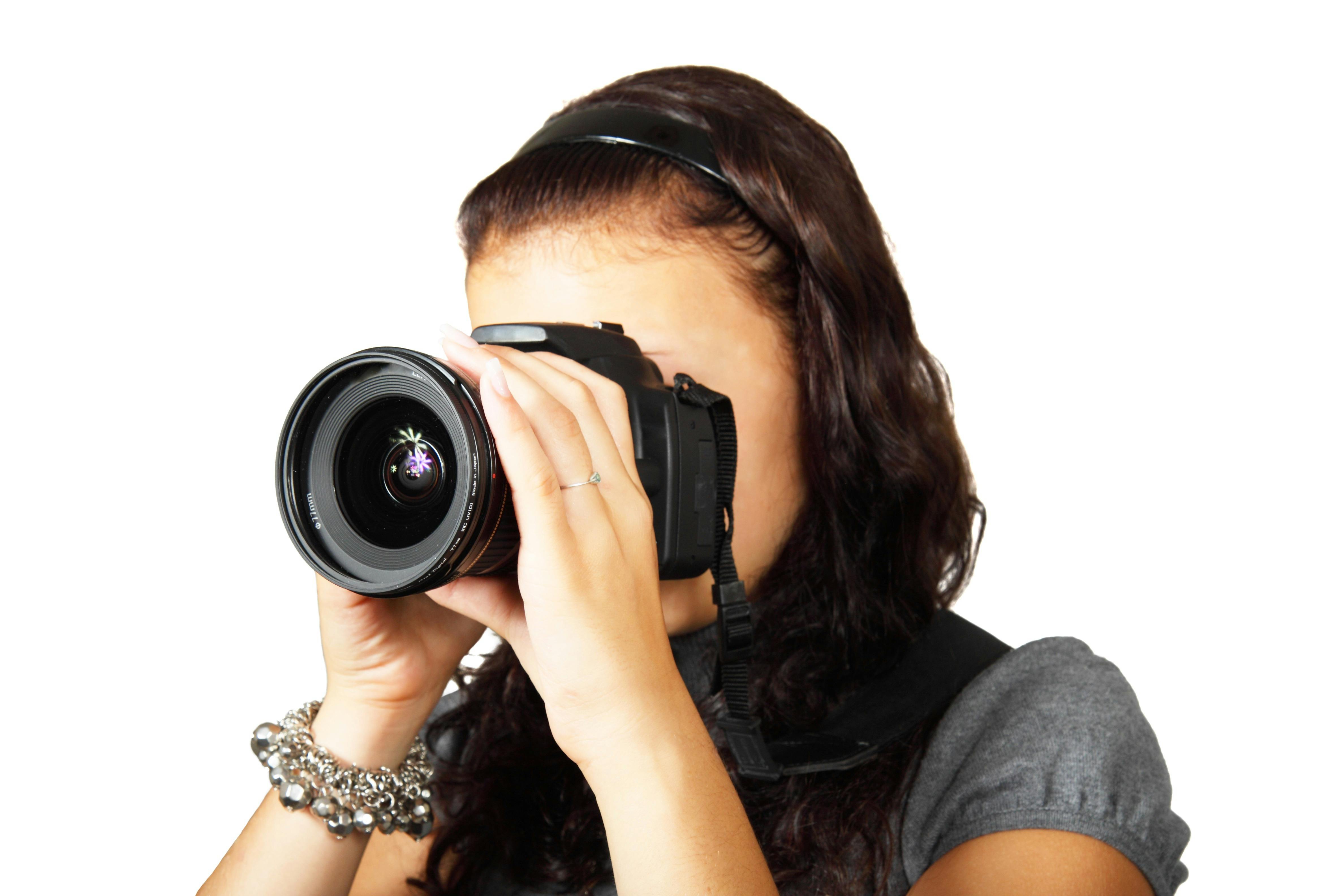  Woman  in Grey Shirt Taking Picture With Dslr Camera   Free 