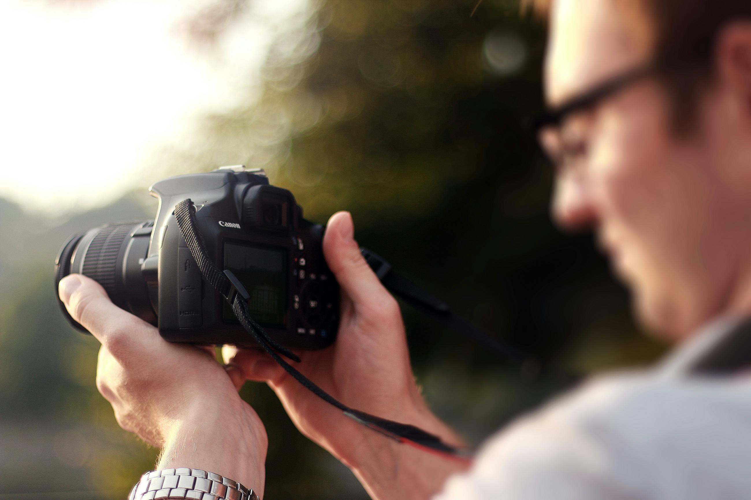 Person Holding Camera during Day Time · Free Stock Photo