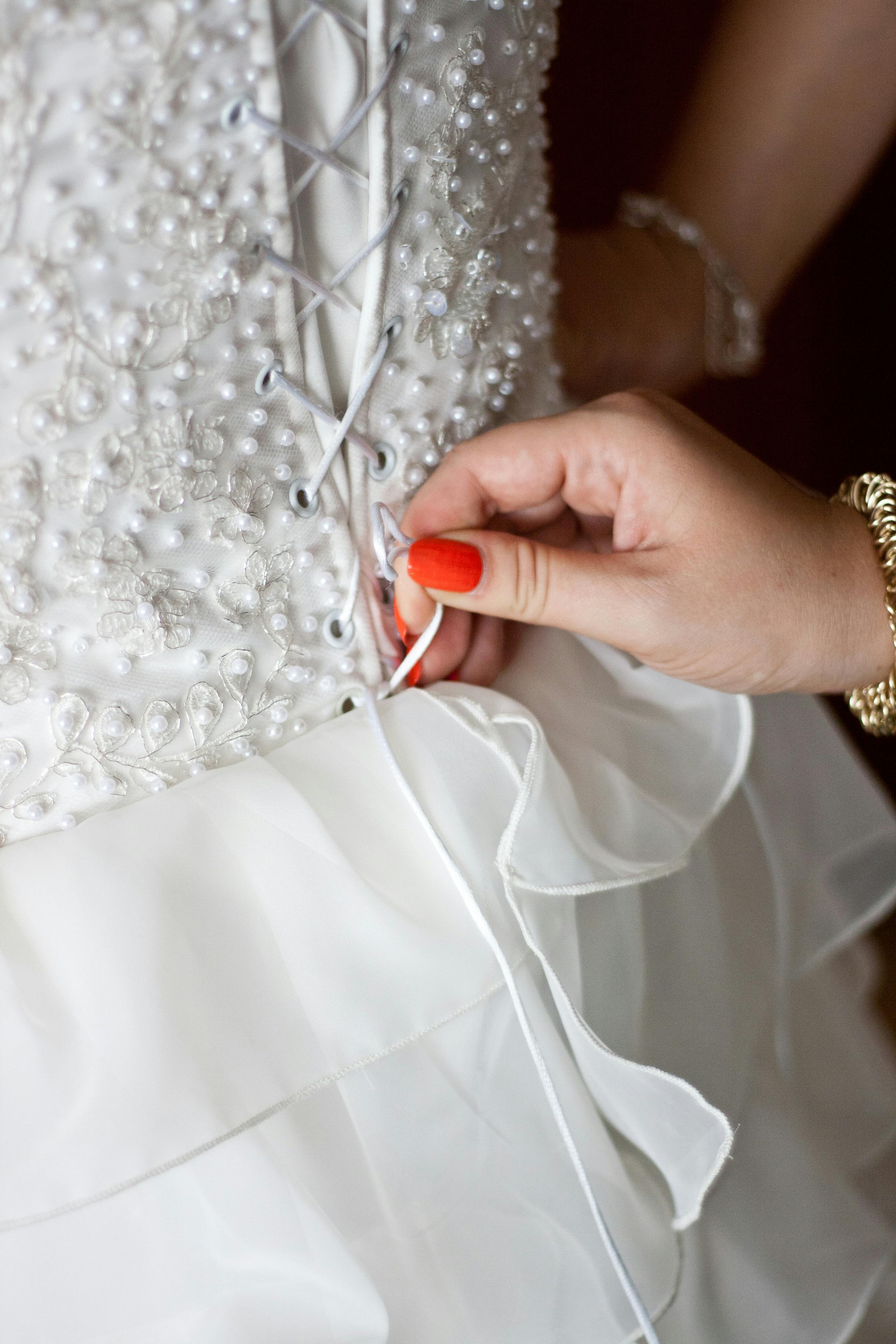 Tie a Corset Back Wedding Dress · Free Stock Photo