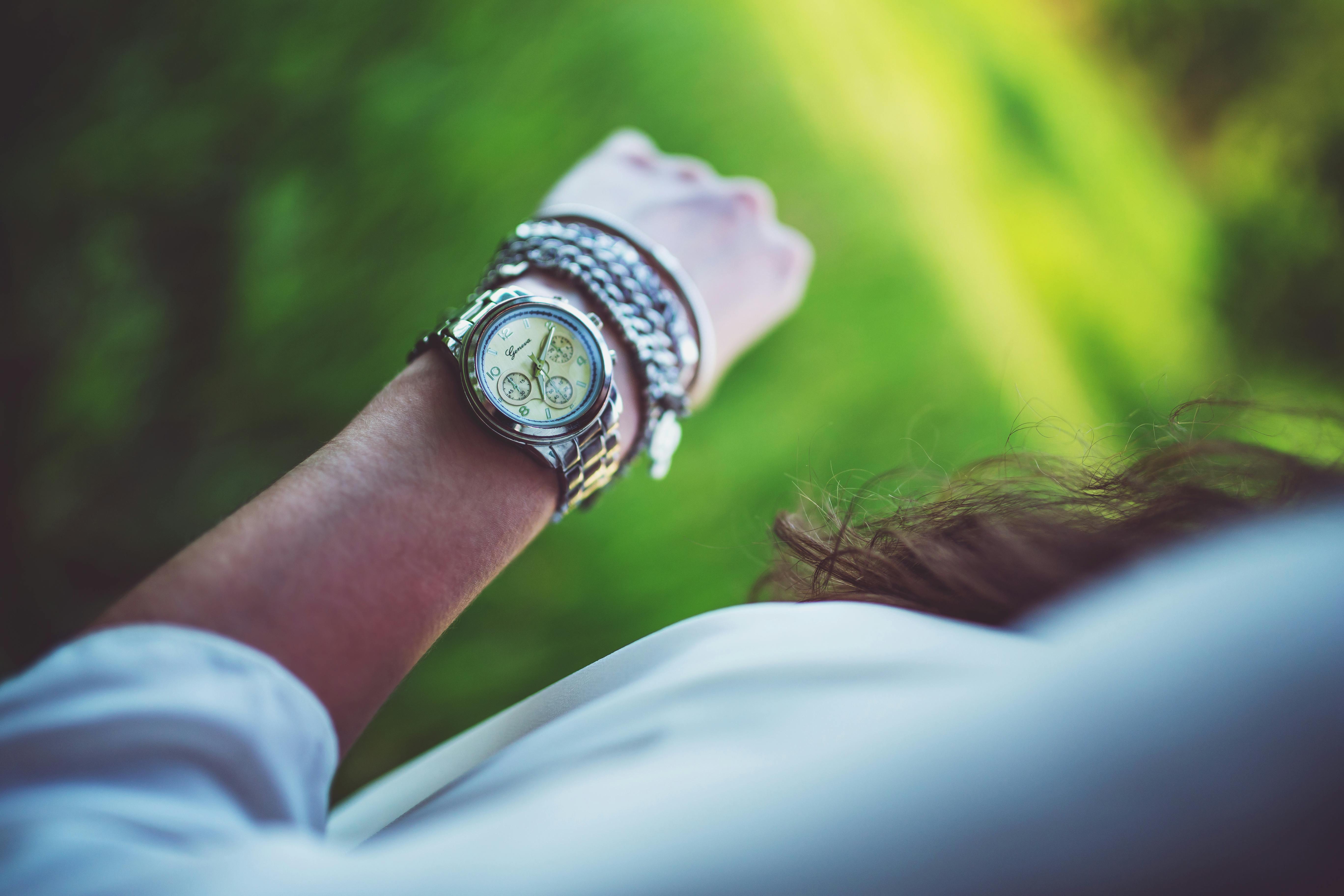 Silver watch on the girl's arm · Free Stock Photo