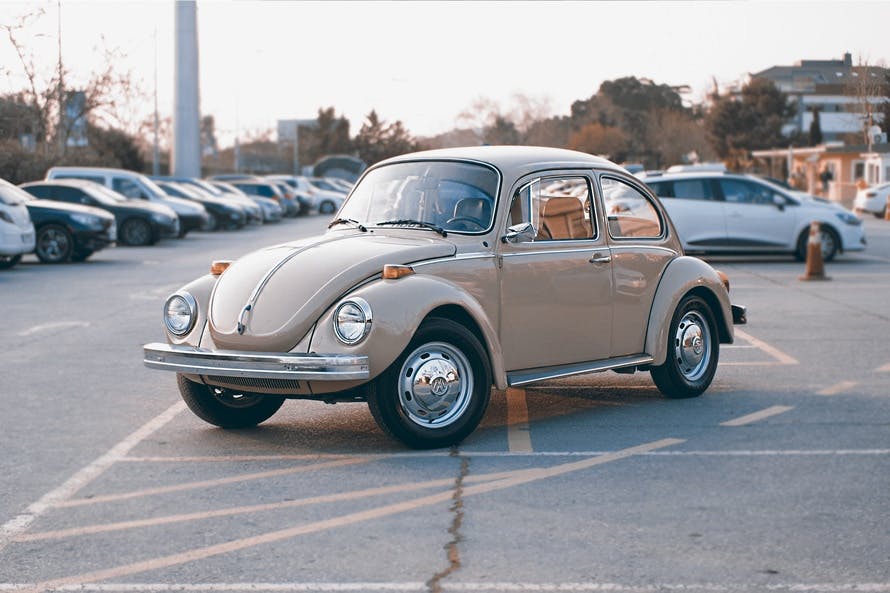 Brown Volkswagen Beetle at Parking Lot