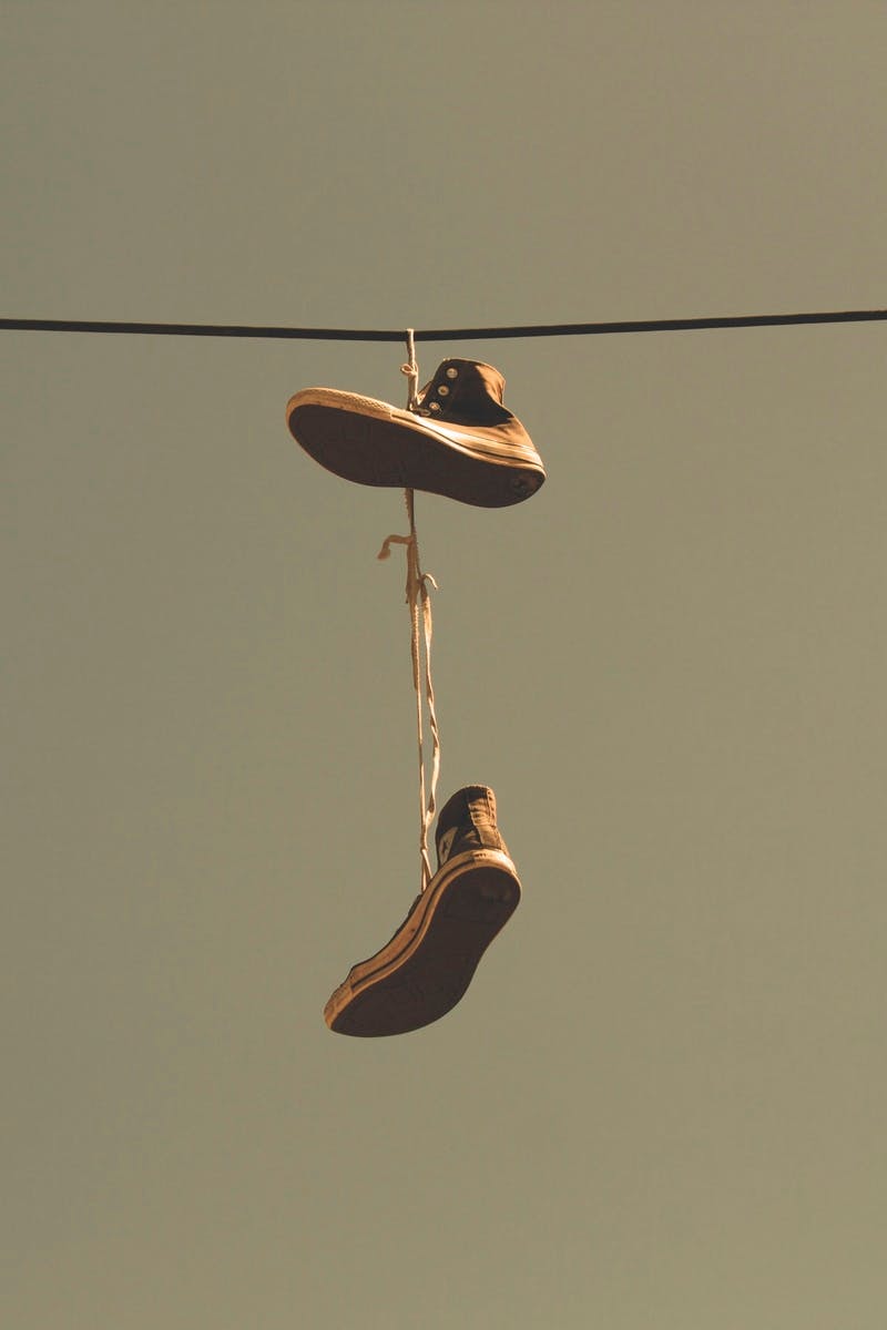 White Black High Top Shoes Hanging on Electric Line · Free Stock Photo