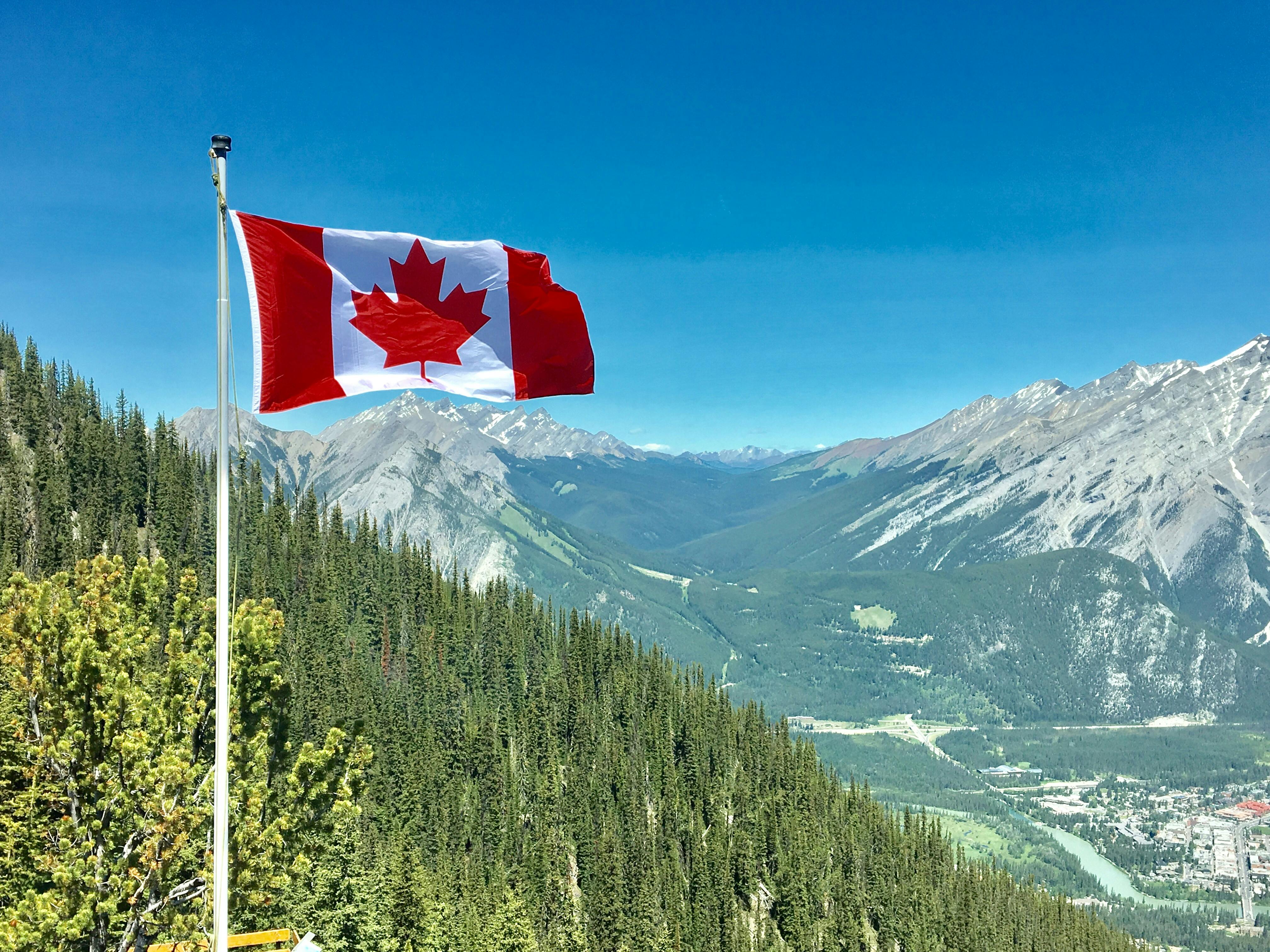 Canada Flag With Mountain Range View \u00b7 Free Stock Photo