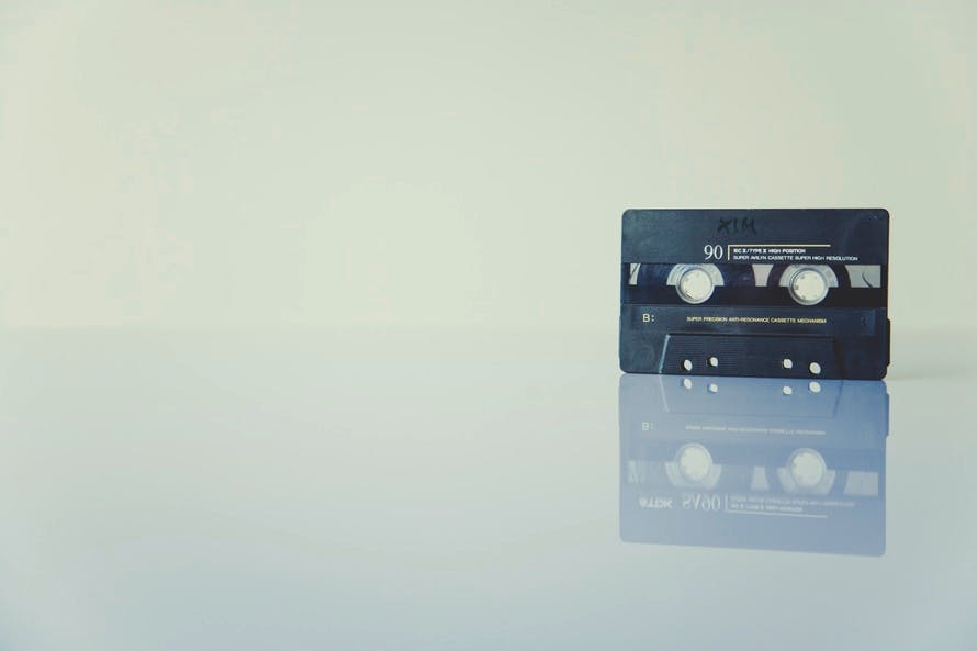 Black Cassette Tape Standing on White Surface