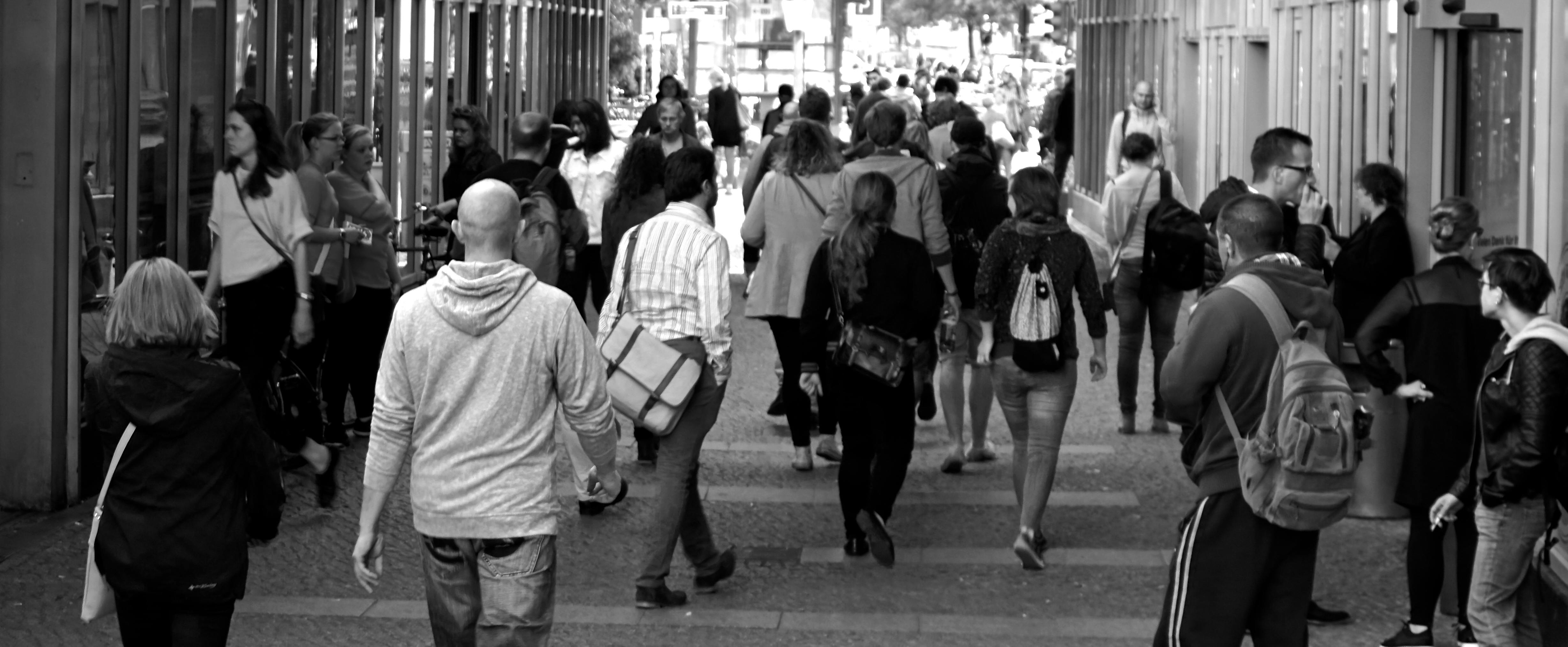 Photograph of people walking in the city